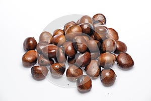 A group of chestnuts lay on white background