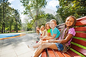 Group of children on the bench in park