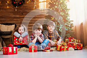 Group children with Christmas presents. Dreamers. photo
