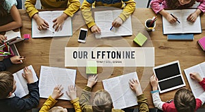 Overhead View of Children Collaborating on Homework and Study