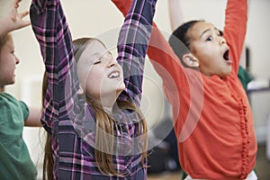 Group Of Children Enjoying Drama Class Together photo