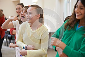 Group Of Children Enjoying Drama Class Together