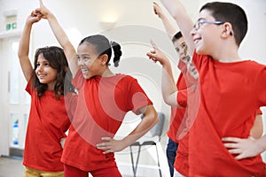 Group Of Children Enjoying Drama Class Together photo