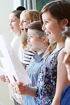 Group Of Children Enjoying Singing Group