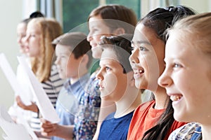 Group Of Children Enjoying Singing Group