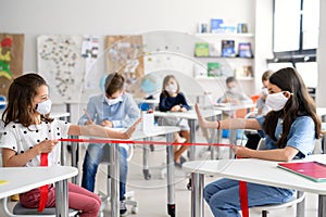 Group of children with face mask back at school after covid-19 quarantine and lockdown.