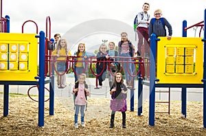 Group Of Children have fun play on the Playground