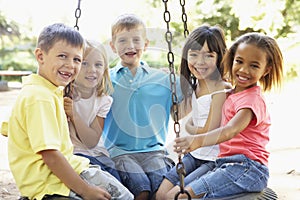 Group Of Children Having Fun In Playground Together