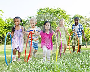 Group of Children Hula Hooping in the Park