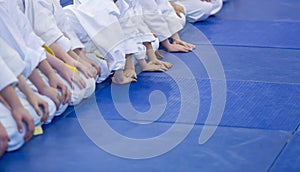 Group of children in kimono sitting on tatami