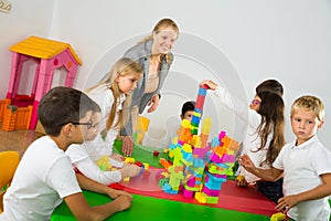Group of children playing with colorful blocks