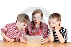 Group of Children Playing Exciting Game on Tablet Isolated on White