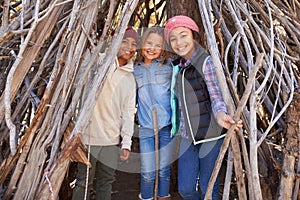 Group Of Children Playing In Forest Camp Together