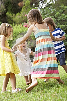 Group Of Children Playing Outdoors Together