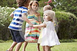 Group Of Children Playing Outdoors Together