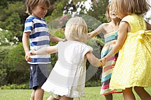 Group Of Children Playing Outdoors Together