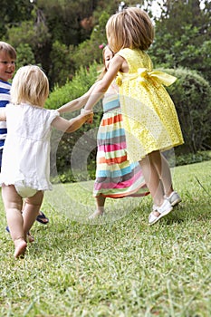 Group Of Children Playing Outdoors Together