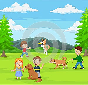 Group of children playing with their dogs in the park