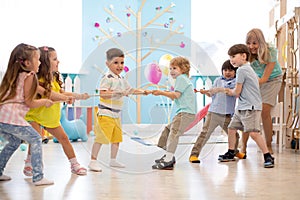 Group of children in a rope-pulling contest