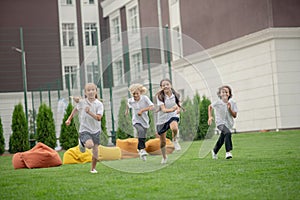 Group of children running and looking energized