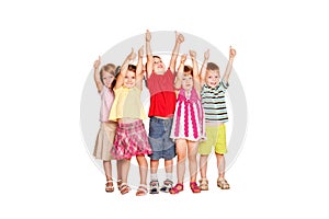 Group of children showing thumbs up sign