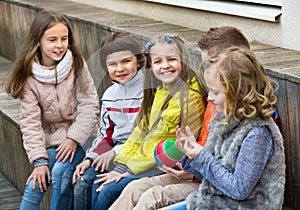 Group of children sitting on bench