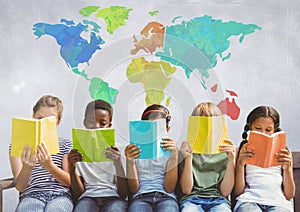 Group of children sitting and reading in front of colorful world map