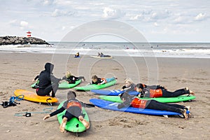 Group of children at surfing training on the beach