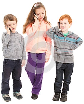 Group of children talking on mobile phones.