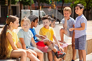 Group children are talking about play on walk in the park