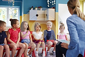 Group of children and teacher in the preschool