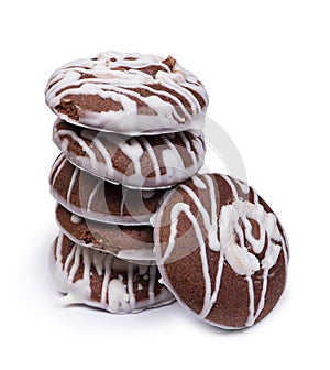 Group of chocolate cookies drizzled with white icing