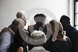 Group of christian people are praying together photo