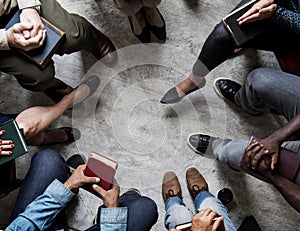 Group of christianity people sitting reading bible together