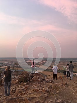 A group of Christians pray a morning prayer on a local mountain facing Tonlesap Lake, the largest freshwater lake in Southeast Asi