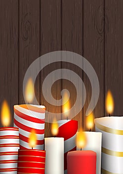 Group of Christmas burning candles on wood