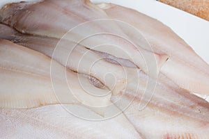 A group of clean and raw fresh megrim fish.