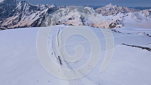 A group of climbers makes an acclimatization hike on Mount Elbrus