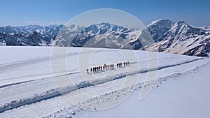 A group of climbers makes an acclimatization hike on Mount Elbrus