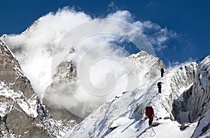 Group of climbers on mountains montage to mount Lhotse