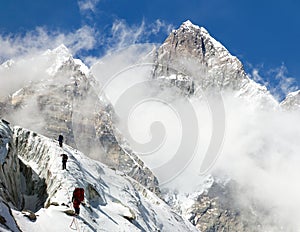 Group of climbers on mountains montage to mount Lhotse