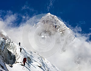 Group of climbers on mountains montage to mount Lhotse