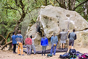 Group of climbers practicing bouldering