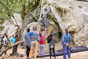 Group of climbers practicing bouldering