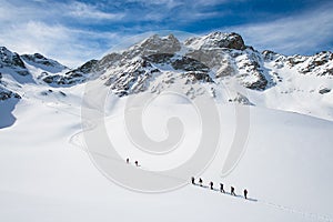 Group of climbers roped to the summit