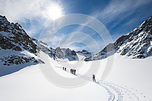 Group of climbers roped to the summit photo