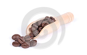 Group of coffee beans in a wooden scoop isolated on white background