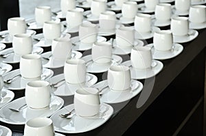 Group of coffee cups.empty cups for coffee.Many rows of white cup for service tea or coffee in breakfast at buffet event.white cup