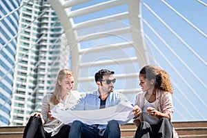 group of colleagues are discussing documents and ideas for working together.