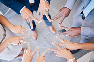 Group of colleagues peace sign hands together for victory, success and unity or teamwork, collaboration and bonding